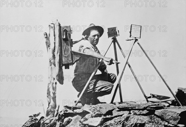 Signal station in the Rockies, showing telephone installation and signal man using heliograph ca. 1909