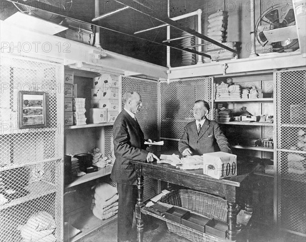 Treasury Department, men working inside the cash room vault for daily working funds ca. 1909