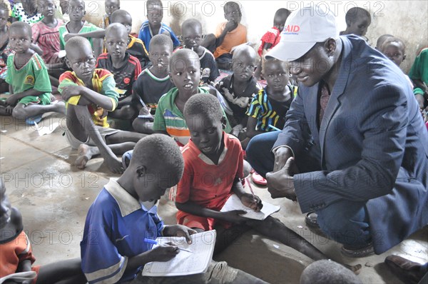 South Sudan has the highest rate of out-of-school children in the world, here some children receive education via a USAID worker ca. 28 August 2017