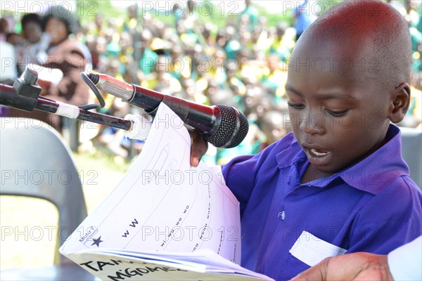 In Malawi, a young primary school student demonstrates his reading ability ca. 17 July 2012