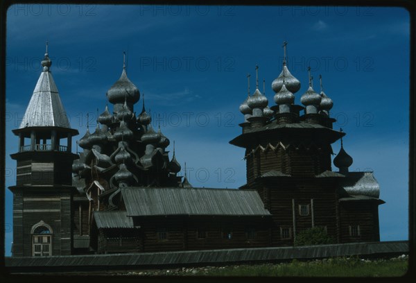 Pogost ensemble, Church of the Intercession (1764), (right); with bell tower (19th century); and Church of the Transfiguration (1714), south view, Kizhi Island, Russia; 1993