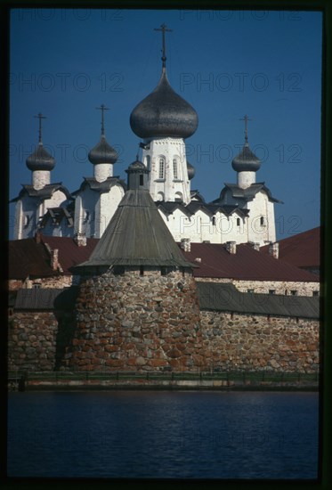 Monastery, Cathedral of the Transfiguration of the Savior (1558-1566), Priadil'naia (Spinning) Tower (late 16th century), southwest view across Bay of Felicity, Solovetskii Island, Russia; 1999