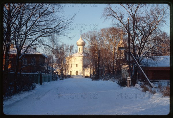 Church of Elijah the Prophet (1698), southeast view, with wooden houses on Zasodimskii street, Vologda, Russia 1997.