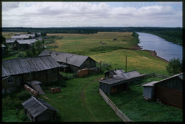 Log houses along Kimzha River, view south, Kimzha, Russia; 2000