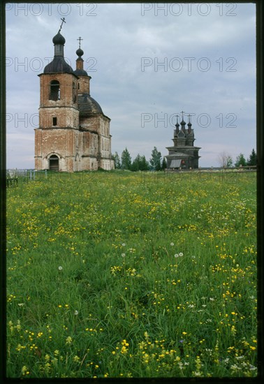 Church of Resurrection (1752), and log Church of St. George (1665), southwest view, Permogor'e, Russia; 2000