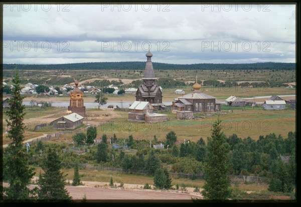 Northeast panorama with Church of the Dormition (1674) (center), and Church of St. Afanasii (1857) (right), with Varzuga River in background, Varzuga, Russia; 2001