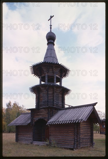 Log Church of the Savior from the village of Zashiversk (1700), bell tower, northeast view, moved and reassembled in the Outdoor Architecture and History Museum at Akademgorodok, Russia 1999.