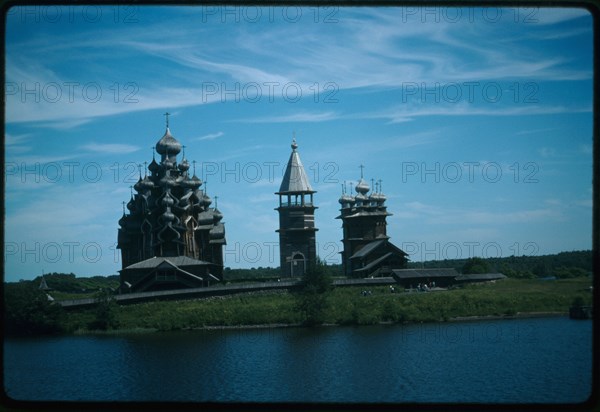 Pogost ensemble, Church of the Transfiguration (1714) (left); bell tower (19th century); Church of the Intercession (1764), west view, Kizhi Island, Russia; 1993