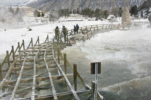 Workers removing boardwalk at Palette Spring in Mammoth Hot Springs in Yellowstone National Park;  Date: 16 February 2006