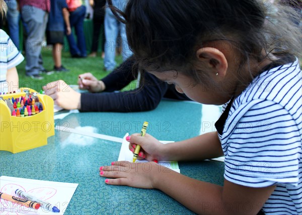 Ojai, Calif. (March 18, 2017) - Visitors color seed packets to hold native pollinator seeds during an event at the Libbey Bowl celebrating women in science