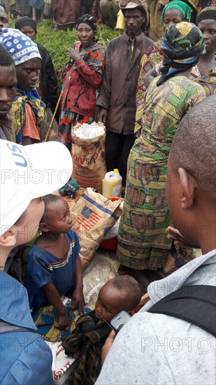 A relief worker and those in need in North Kivu Cote d’Ivoire (Ivory Coast) ca. 23 March 2017