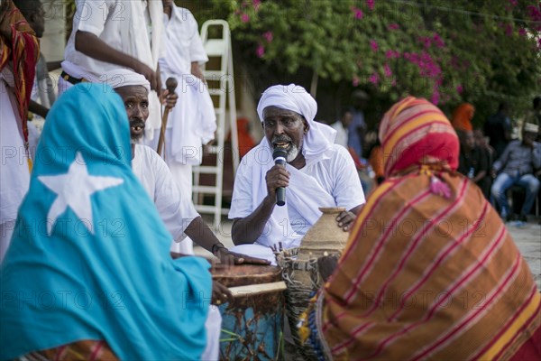 A man speaking with microphone in Garowe, Puntland ca. 1 June 2015