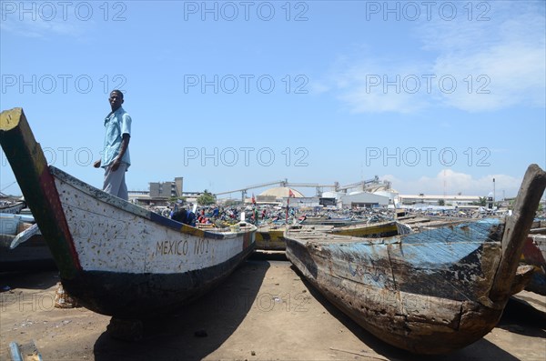 Boats on dock at fishing port of Tema in Ghana ca. 19 October 2011