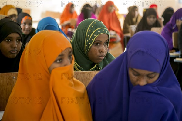 Young Muslim women listen during a teacher training session in Mogadishu or Garowe via the Somali Youth Learners Initiative (SYLI) ca. 16 June 2015