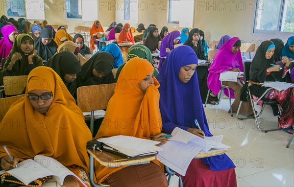 Young Muslim women listen during a teacher training session in Mogadishu or Garowe via the Somali Youth Learners Initiative (SYLI) ca. 16 June 2015