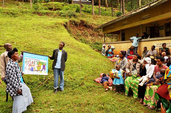 A community group meeting in Karrowa Village in SW Uganda. Group leaders are teaching about important WASH and nutrition behaviors ca. 13 March 2018