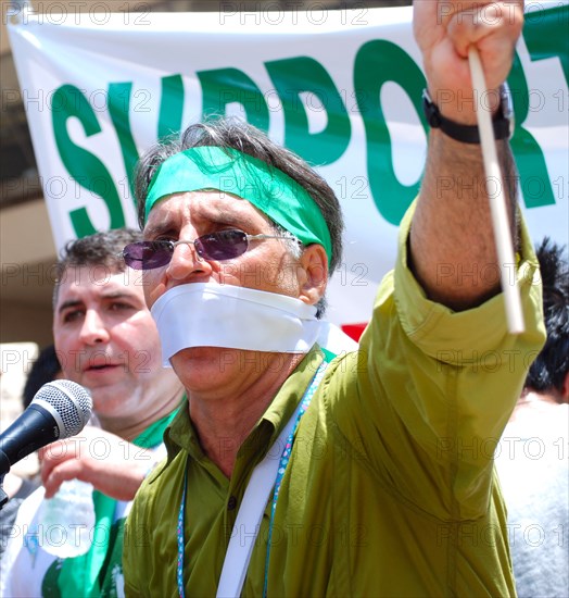 Iranians in Texas taking part in a Freedom for Iran / Green Revolution rally at Dallas City Hall plaza in downtown Dallas, TX ca. June 2009