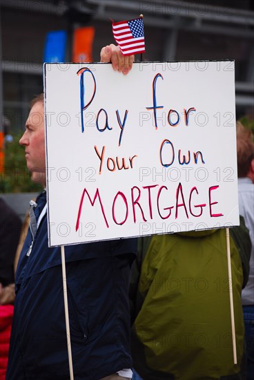 Attendees holding signs at a Tea Party rally in Dallas, TX (one of the first in the United States on Feb. 26 2009)