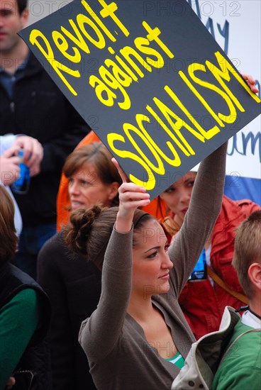 Attendees holding signs at a Tea Party rally in Dallas, TX (one of the first in the United States on Feb. 26 2009)