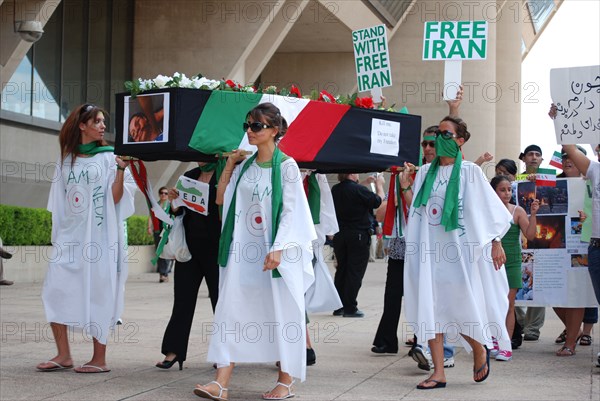 Iranians in Texas taking part in a Freedom for Iran / Green Revolution rally at Dallas City Hall plaza in downtown Dallas, TX ca. June 2009