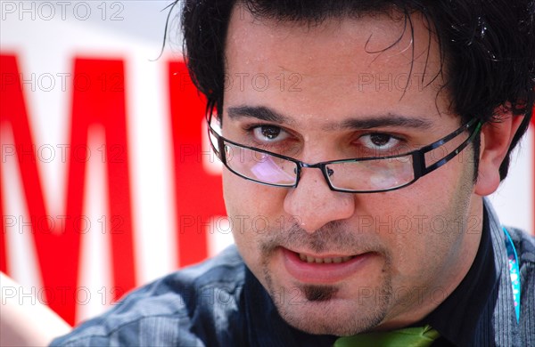 Iranians in Texas taking part in a Freedom for Iran / Green Revolution rally at Dallas City Hall plaza in downtown Dallas, TX; close up of a speaker ca. June 2009