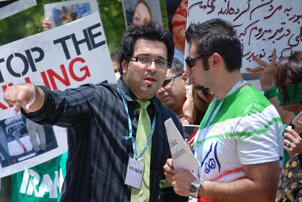 Iranians in Texas taking part in a Freedom for Iran / Green Revolution rally at Dallas City Hall plaza in downtown Dallas, TX ca. June 2009