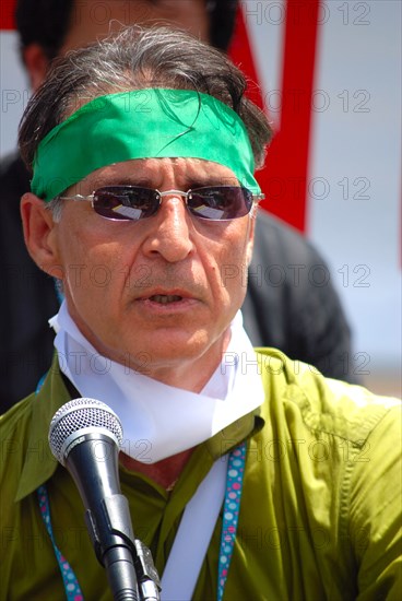 Iranians in Texas taking part in a Freedom for Iran / Green Revolution rally at Dallas City Hall plaza in downtown Dallas, TX; rally speaker ca. June 2009