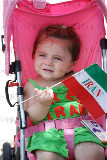 Iranians in Texas taking part in a Freedom for Iran / Green Revolution rally at Dallas City Hall plaza in downtown Dallas, TX ca. June 2009