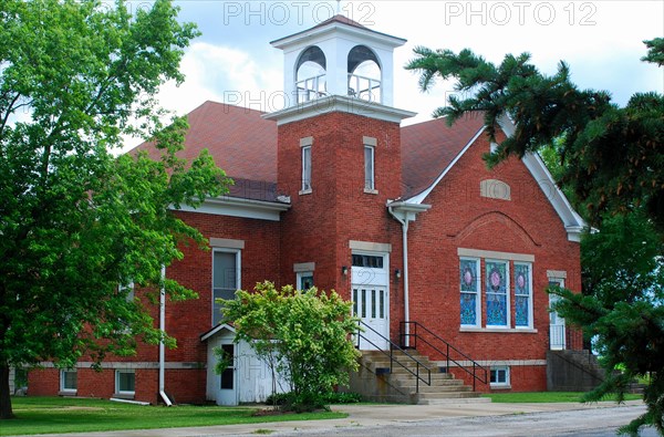 Red brick church on the plains of East Central Illinois, Hindsboro Christian Church on a cloudy day