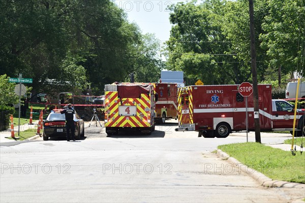 First responders; firemen and paramedics, help trapped construction worker trapped in a trench; Irving, TX USA