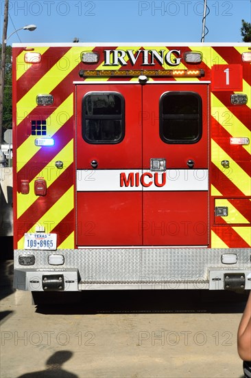 First responders; firemen and paramedics, help trapped construction worker trapped in a trench; the rescued worker has been placed in the ambulance Irving, TX USA