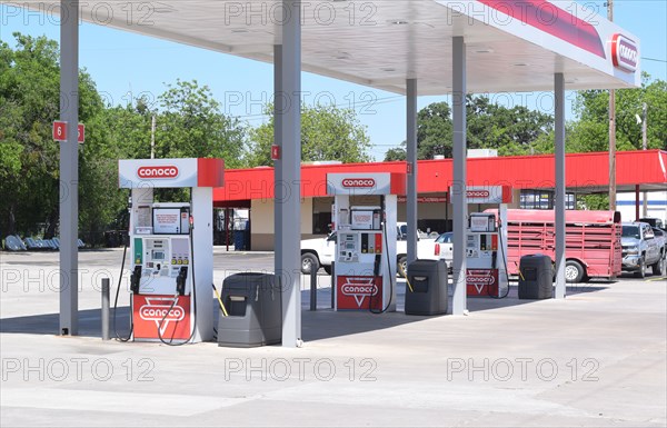 Gas pumps at a Conoco gas station in Commanche, TX