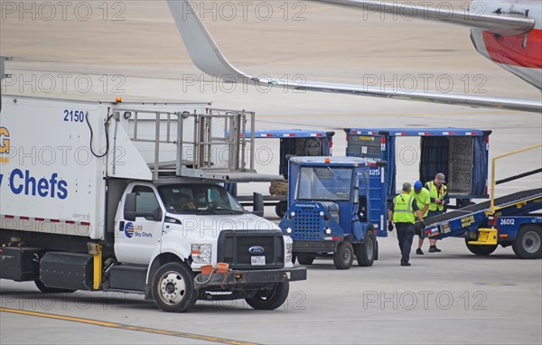 Dallas-Ft. Worth Airport: An LSG Skychefs truck prepares to service an American Airlines Boeing 737 at Terminal D South at DFW Airport