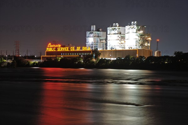 Public Service Company of Oklahoma plant along the Arkansas River in Tulsa, Oklahoma at night