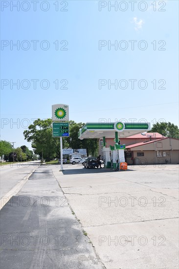 Customers pumping gas at the BP gas station in Cissna Park, Illinois