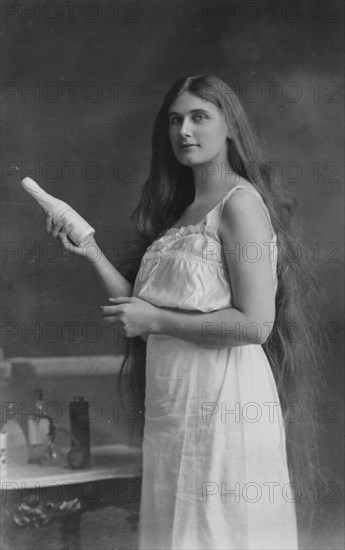 Early 20th-century Beauty with beauty products