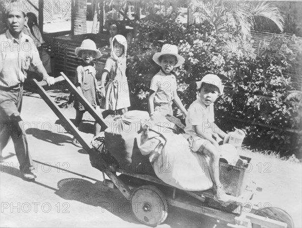 Fleeing home after a Japanese bombardments, 1941