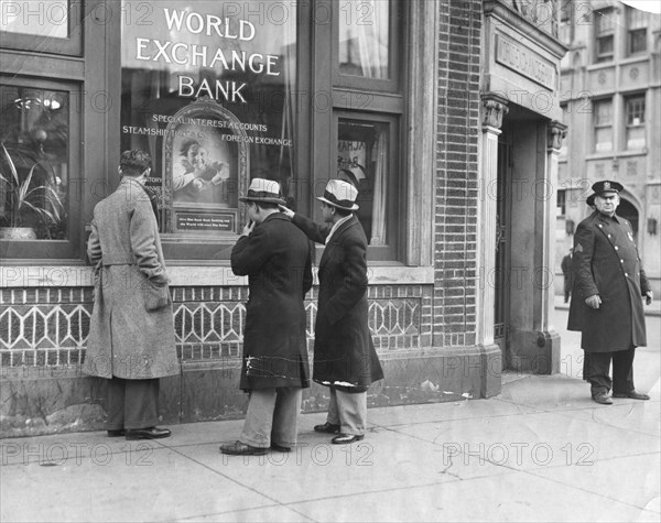 Police stand guard at the entrance to the World Exchange Bank