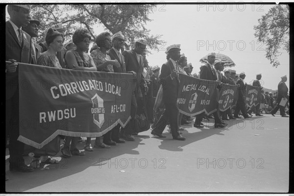 Marchers carrying labor union banners, 1963