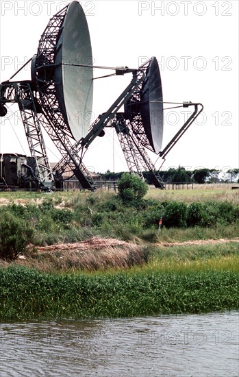 Two large dish-shaped radar antennas