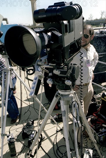 A television cameraman shoots film of Prime Minister Menachem