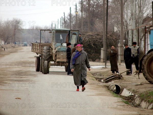 Uzbek woman walks down the street