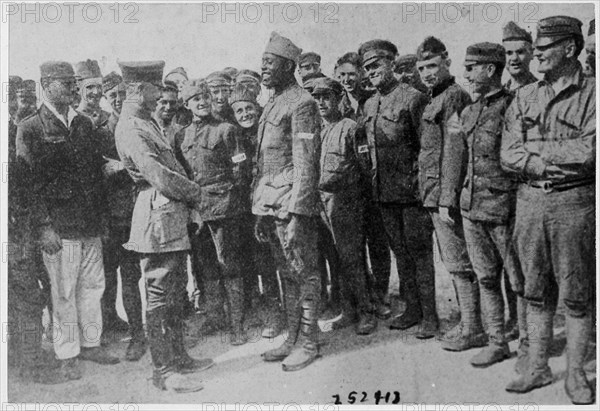 African American World War I soldier in a German prison camp speaks to a German officer.