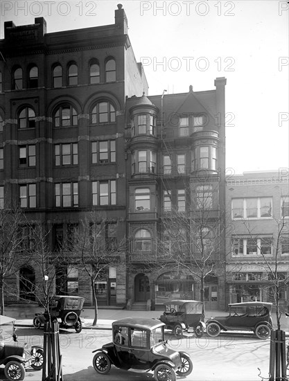 Automobiles parked on city street