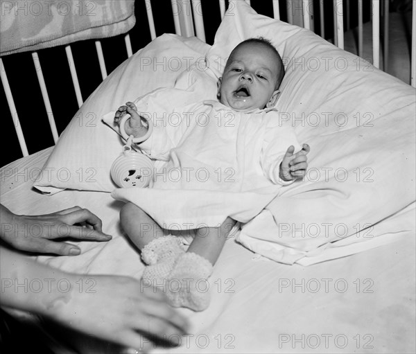 Baby awake in a crib