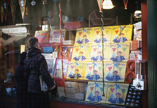 Boy looking at store window display of toys ca 1941