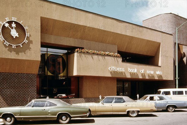 Cars parked in front of Citizens Bank in downtown New Ulm