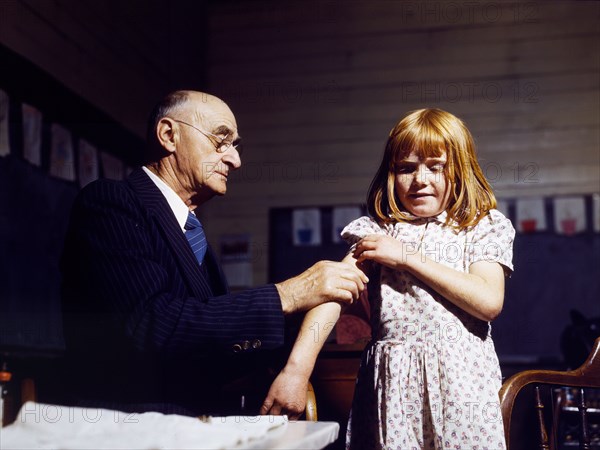 Dr. Schreiber of San Augustine giving a typhoid innoculation at a rural school