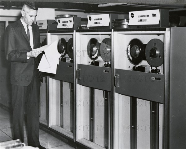 Edward Stone in front of an IBM Computer