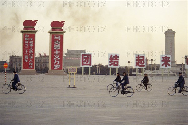 Street Scene with Signs and Bicyclists in Peking